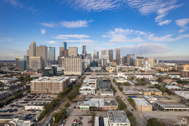 Lonestar Key Master – Professional locksmith services in Houston, Texas Midtown , featuring a view of midtown Houston skyline. 24-7 locksmith solutions.